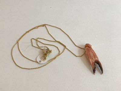Crab claw on gold-plated necklace by Petra Reijrink Jewelry