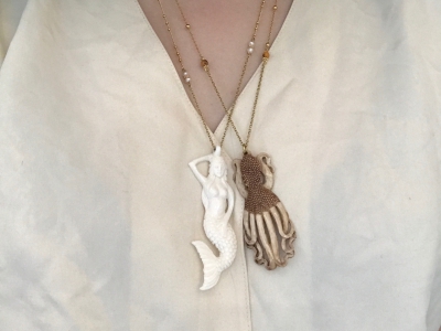 Mermaid and octopus made of bone on gold-plated necklace by Petra Reijrink Jewelry